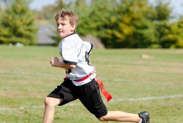 young flag football player running
