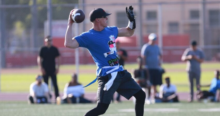 flag football player throwing a football