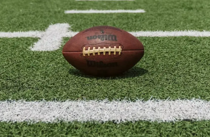 a football sitting on football field