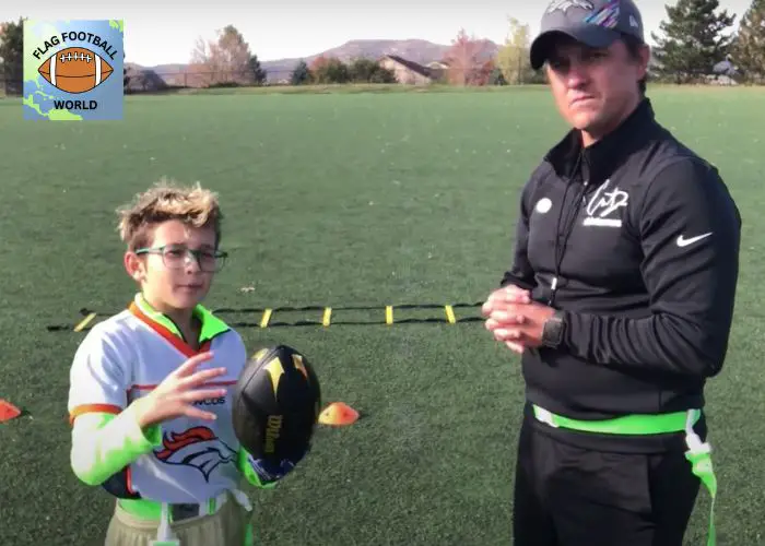 flag football coach with player